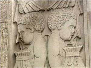 African children holding bags of gold representing the wealth of Africa on a bank building!